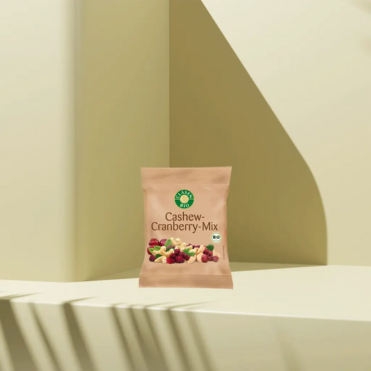 Verpackung Bio-Cashew-Cranberry-Mix 40 g von CLASEN BIO. Knackige Cashewkerne kombiniert mit fein-säuerlichen Cranberries im praktischen Snack-Beutel – perfekt für unterwegs oder als natürlicher Energieschub zwischendurch.